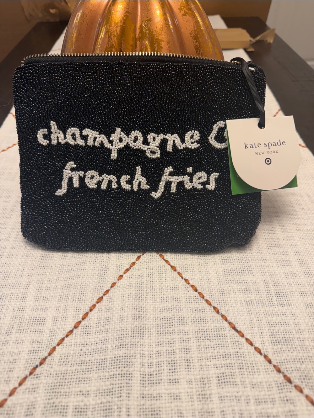 kate spade black beaded pouch with white script